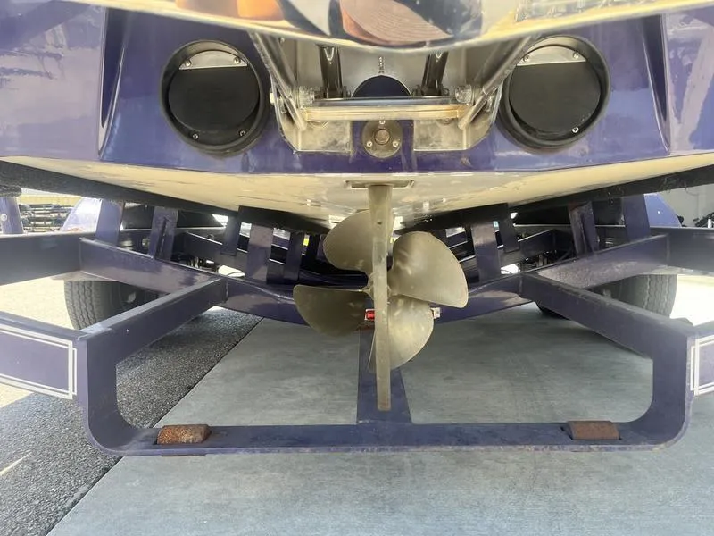 Slide: The Image of 2007 Malibu 247 LSV boat propeller and trailer close-up. - 7