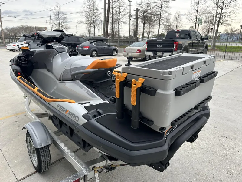 Slide: The Image of 2023 Sea-Doo Fish/Pro jet ski with fishing gear on trailer. - 3