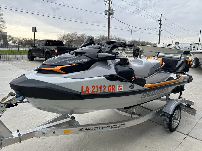 Slide: The Image of 2023 Sea-Doo Fish/Pro jet ski on a trailer in a parking lot. - 5