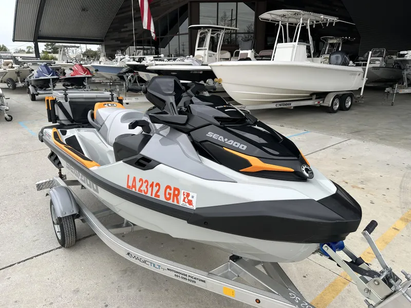 Slide: The Image of 2023 Sea-Doo Fish/Pro jet ski on a trailer at a boat dealership. - 7