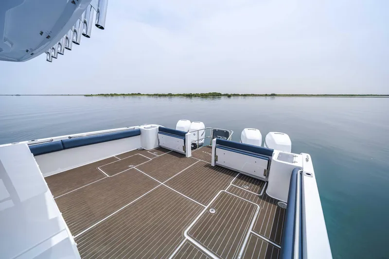 Slide: The Image of Custom SilverCAT 40CC 2025 boat deck with sleek design on calm water. - 13