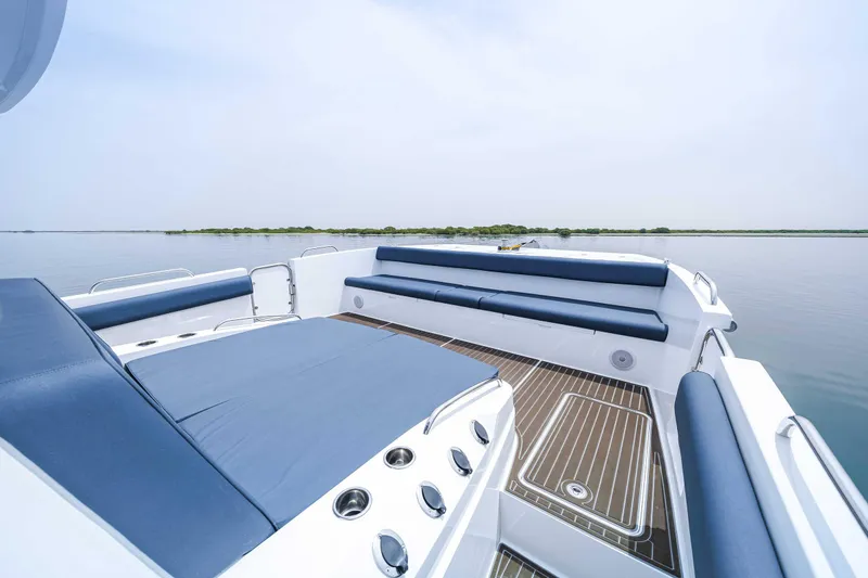 Slide: The Image of Luxurious 2025 Custom SilverCAT 40CC boat interior with blue seating and wooden deck. - 15