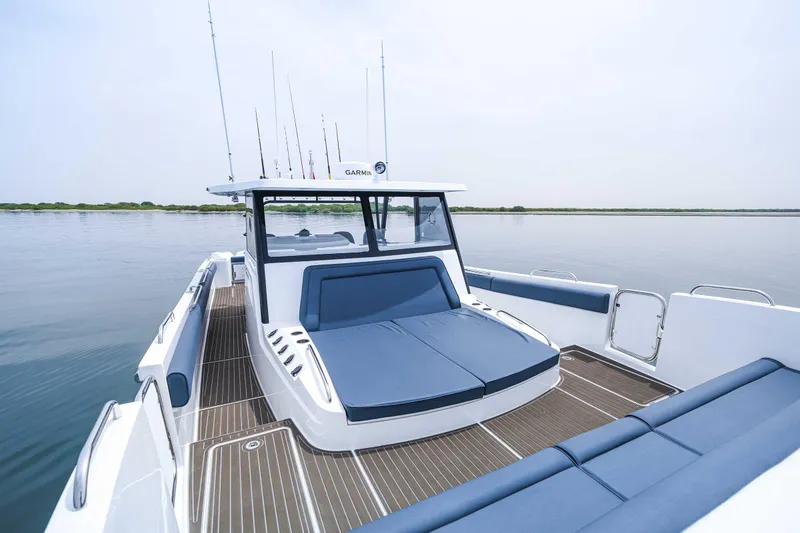 Slide: The Image of Custom SilverCAT 40CC 2025 boat with sleek design and spacious deck on calm water. - 16