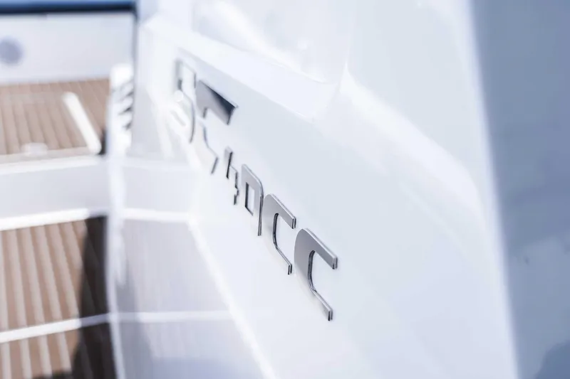 Slide: The Image of Close-up of 2025 Custom SilverCAT 40CC boat logo on sleek white surface. - 23