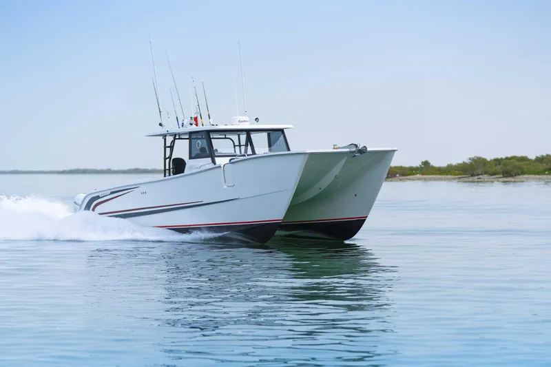 Slide: The Image of Custom SilverCAT 40CC 2025 catamaran cruising on calm water, showcasing sleek design and performance. - 27