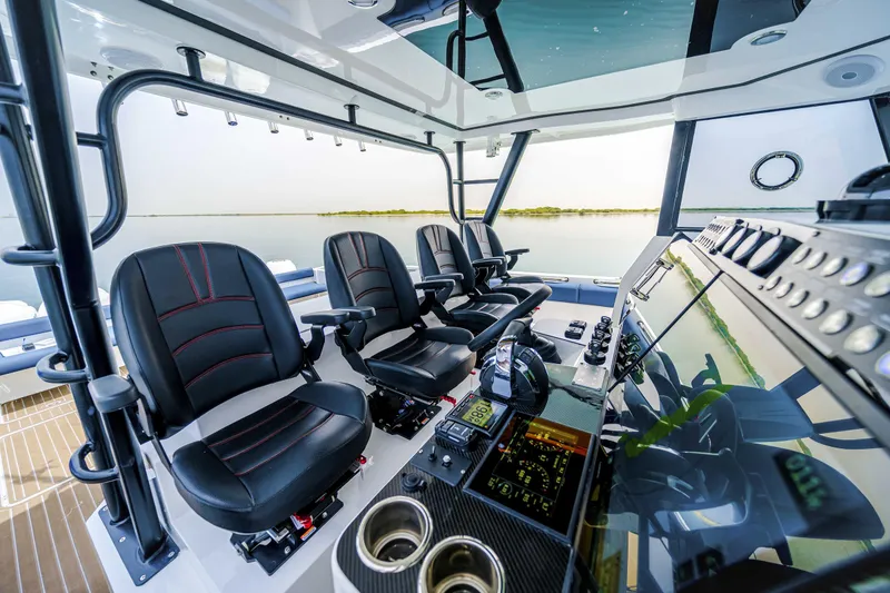 Slide: The Image of Interior of 2025 Custom SilverCAT 40CC boat with modern seating and control panel. - 4