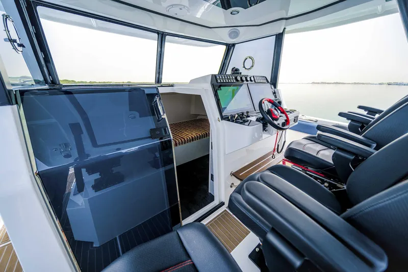 Slide: The Image of Interior of 2025 Custom SilverCAT 40CC boat with modern cockpit and seating. - 5