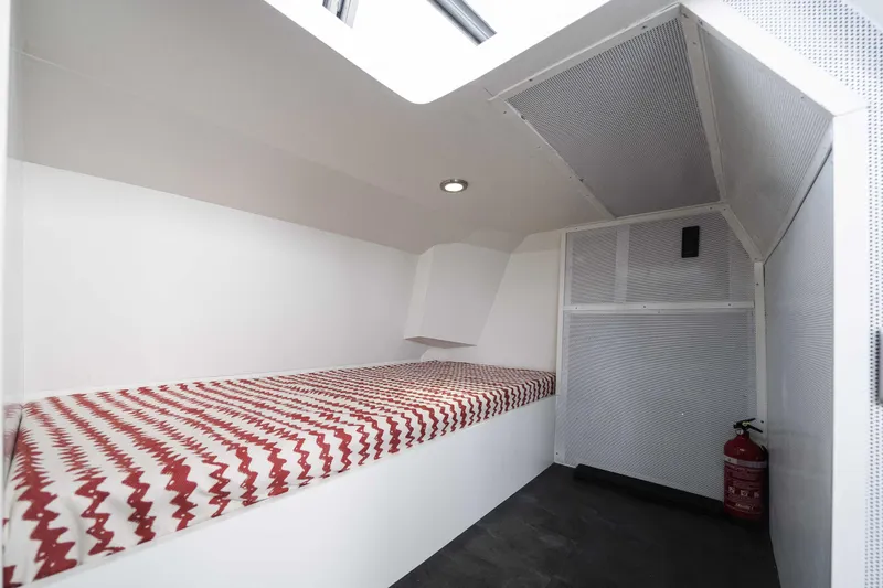 Slide: The Image of Interior of 2025 Custom SilverCAT 40CC boat with bed and fire extinguisher. - 6