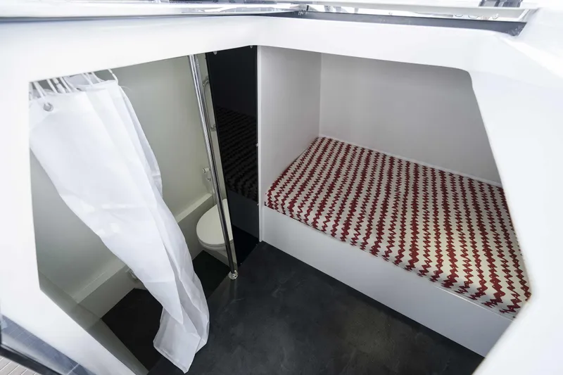 Slide: The Image of Interior of 2025 Custom SilverCAT 40CC boat with bed and compact bathroom. - 7