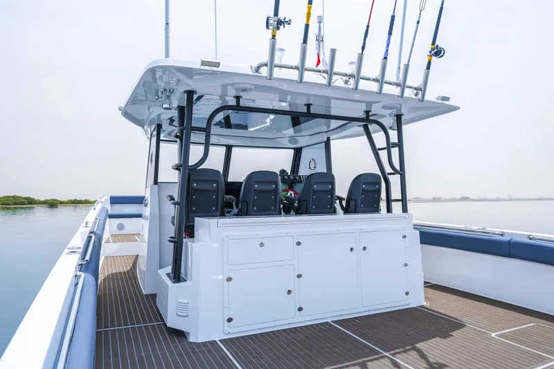 Slide: The Image of Custom SilverCAT 40CC 2025 boat with fishing rods, sleek design, and spacious deck. - 9