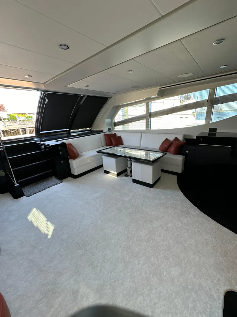 Slide: The Image of Luxurious interior of 2019 Van der Valk BeachClub 600 yacht with modern seating and large windows. - 13
