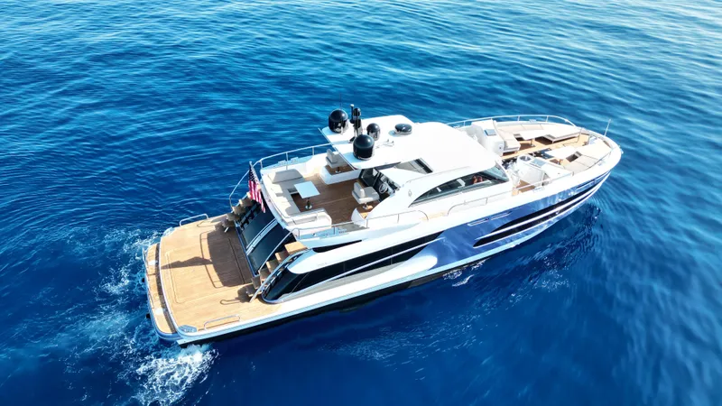 Slide: The Image of Luxurious 2019 Van der Valk BeachClub 600 yacht cruising on open blue sea. - 2