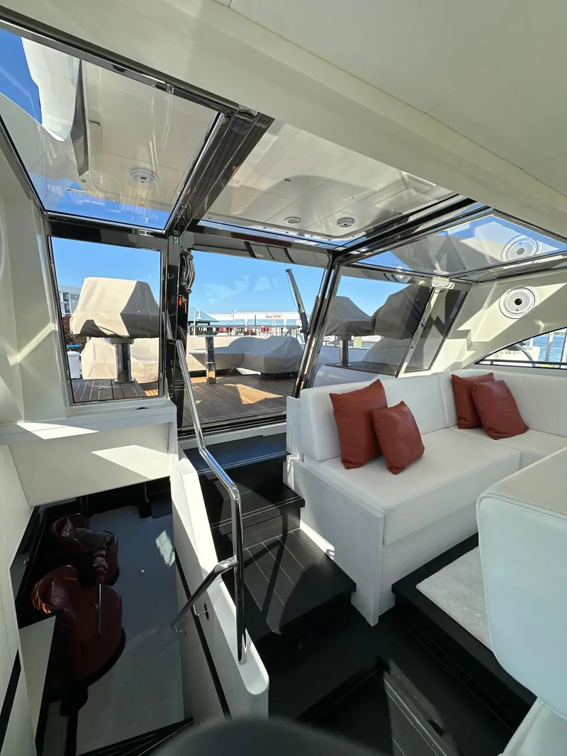 Slide: The Image of Luxurious interior of 2019 Van der Valk BeachClub 600 yacht with white seating and red cushions. - 21