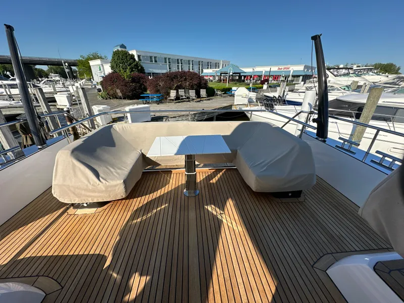 Slide: The Image of Luxurious 2019 Van der Valk BeachClub 600 yacht deck with seating and table, docked at marina. - 23