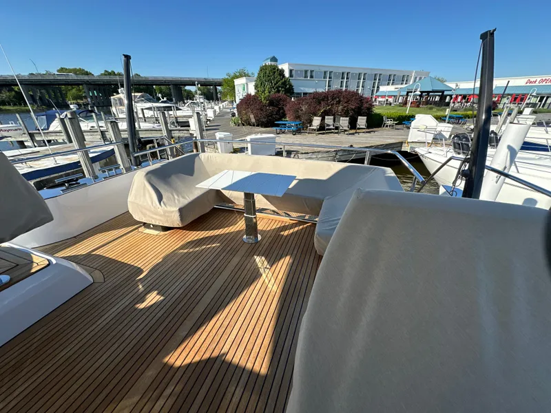 Slide: The Image of Luxurious Van der Valk BeachClub 600 yacht deck with seating, docked at a marina. - 24