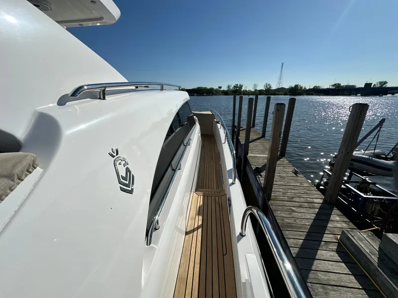 Slide: The Image of 2019 Van der Valk BeachClub 600 yacht docked by a serene waterfront. - 25