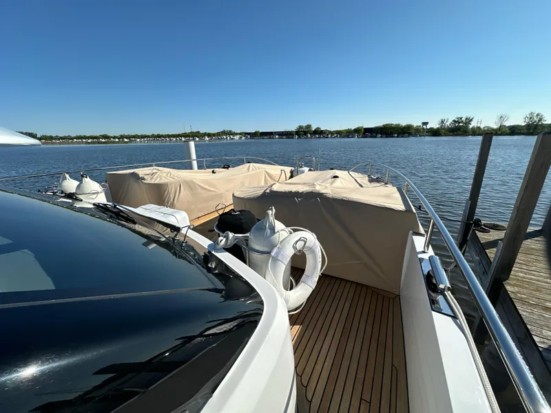 Slide: The Image of Van der Valk BeachClub 600 yacht docked by a serene lake, 2019 model. - 26