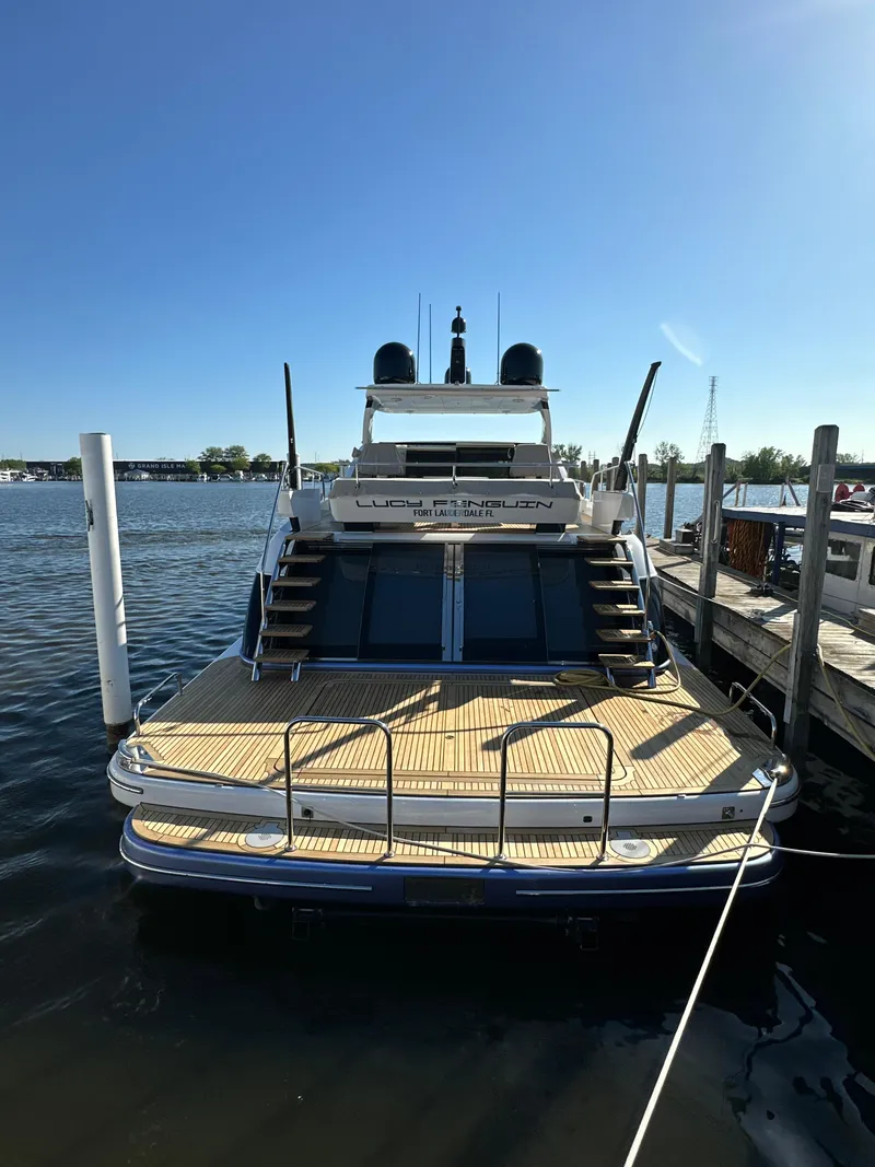 Slide: The Image of Van der Valk BeachClub 600 yacht, 2019 model, docked at a marina under clear blue skies. - 28