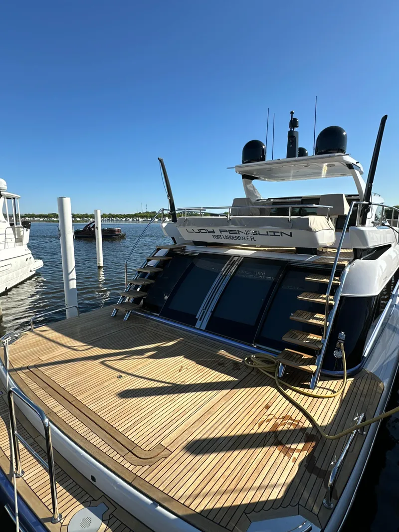 Slide: The Image of 2019 Van der Valk BeachClub 600 yacht docked, showcasing sleek design and spacious deck. - 29