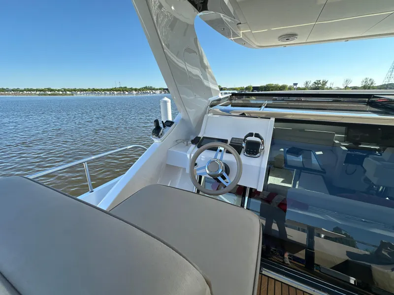Slide: The Image of Luxurious 2019 Van der Valk BeachClub 600 yacht helm with scenic water view. - 31