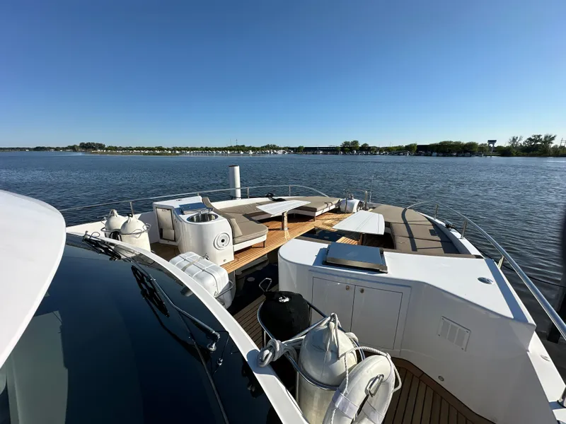 Slide: The Image of Luxurious 2019 Van der Valk BeachClub 600 yacht on serene water, featuring spacious deck amenities. - 38