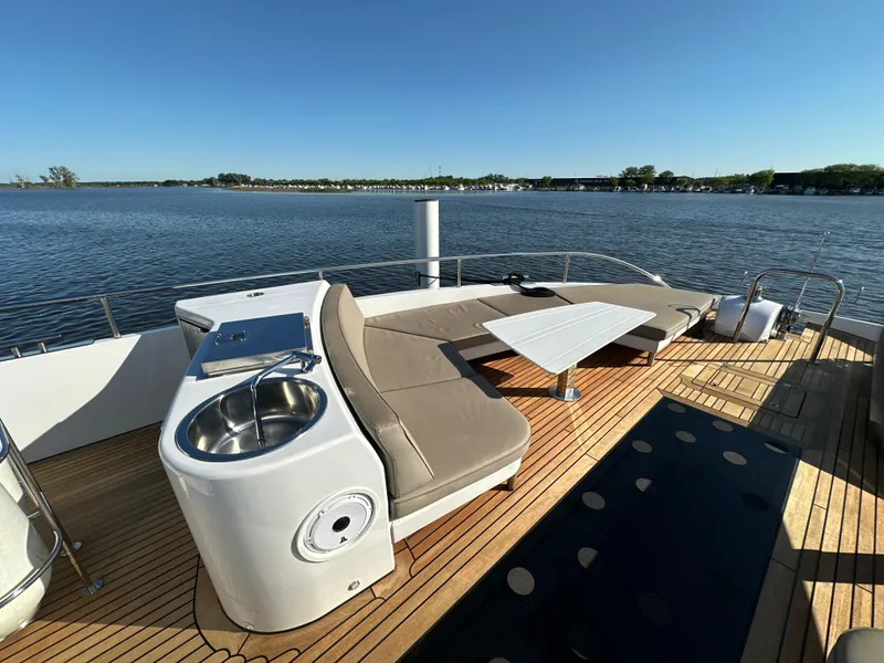Slide: The Image of Luxurious 2019 Van der Valk BeachClub 600 yacht deck with seating and sink, overlooking serene waters. - 41