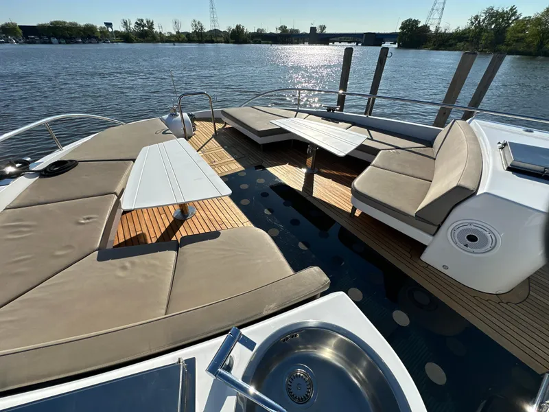 Slide: The Image of Luxurious Van der Valk BeachClub 600 yacht deck with seating, tables, and water view. - 42