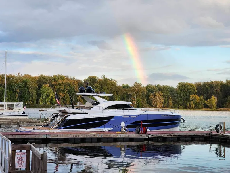 Slide: The Image of 2019 Van der Valk BeachClub 600 yacht docked with rainbow in background. - 49