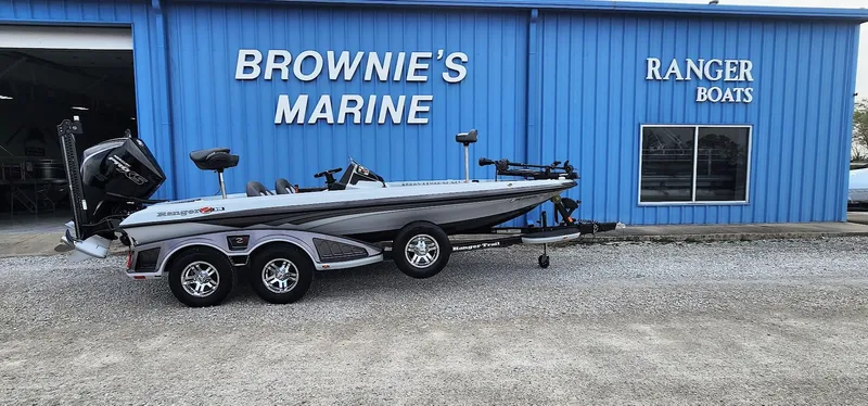 Slide: The Image of 2022 Ranger Z519 boat at Brownie's Marine dealership, blue building background. - 1