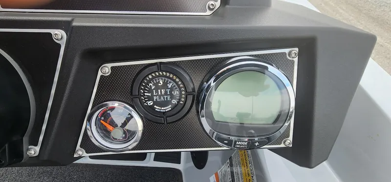 Slide: The Image of Dashboard of 2022 Ranger Z519 boat with gauges and lift plate control. - 8