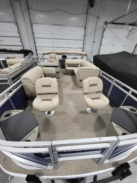 Slide: The Image of 2024 Sun Tracker Fishin Barge 20 DLX pontoon boat interior with beige seating. - 11