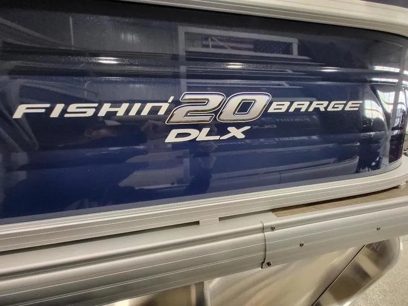 Slide: The Image of 2024 Sun Tracker Fishin Barge 20 DLX pontoon boat side view. - 3