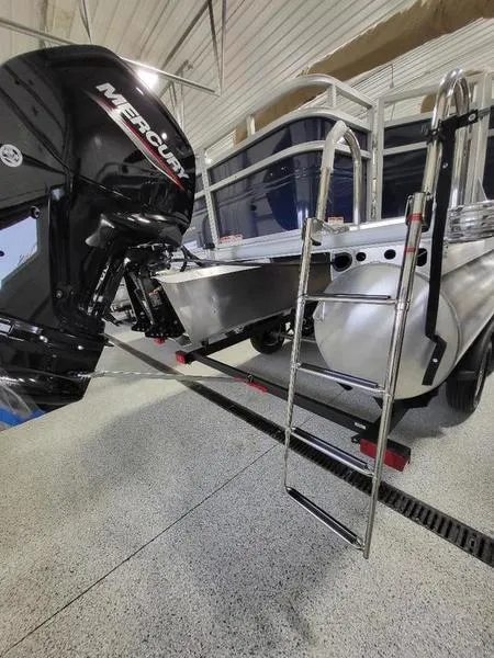 Slide: The Image of 2024 Sun Tracker Fishin Barge 20 DLX with Mercury outboard motor and boarding ladder. - 5