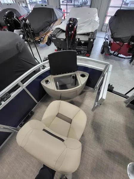 Slide: The Image of 2024 Sun Tracker Fishin Barge 20 DLX interior with fishing seat and rod holders. - 7