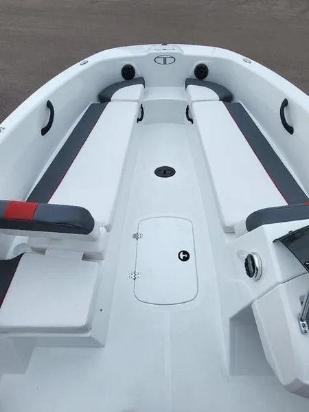 Slide: The Image of 2024 Tahoe T18 boat interior with white and gray seating. - 7