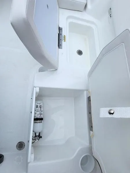 Slide: The Image of 2024 Tahoe T18 boat interior storage compartments and seating. - 8
