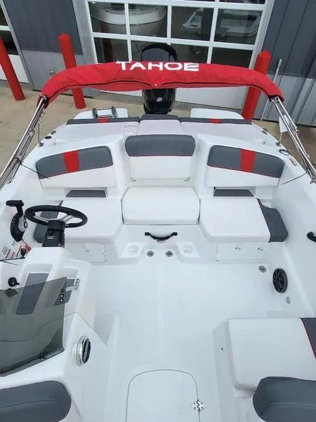 Slide: The Image of 2024 Tahoe T18 boat interior with red canopy and seating. - 9