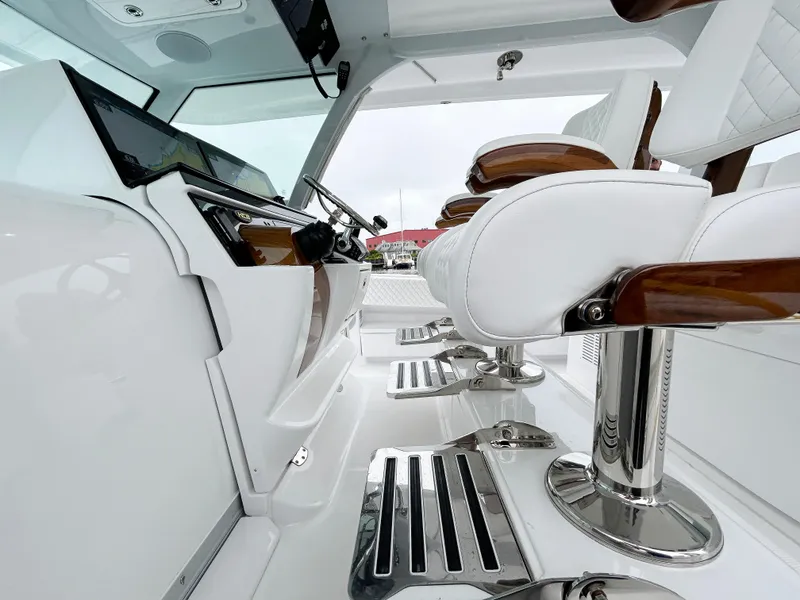 Slide: The Image of Luxurious interior of 2025 HCB 48 Campeon boat with sleek white seating. - 29