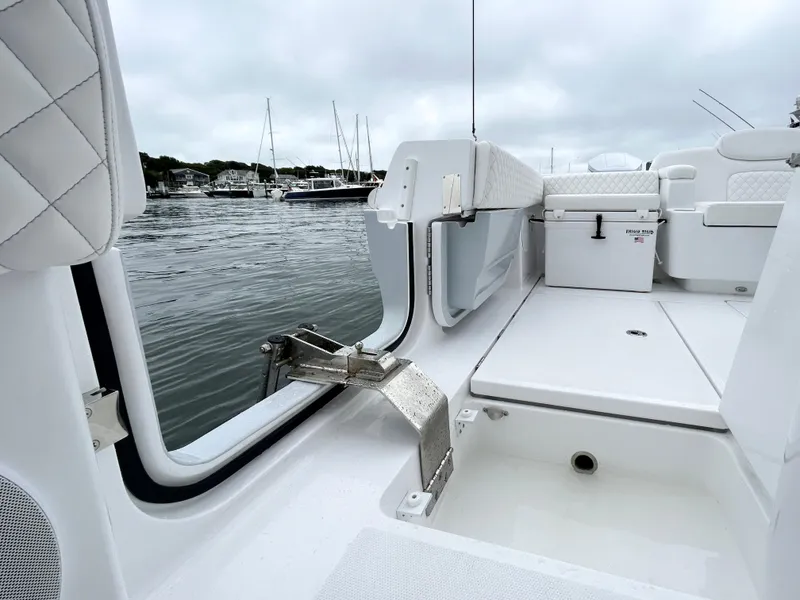 Slide: The Image of 2025 HCB 48 Campeon boat interior with open deck, near marina. - 45