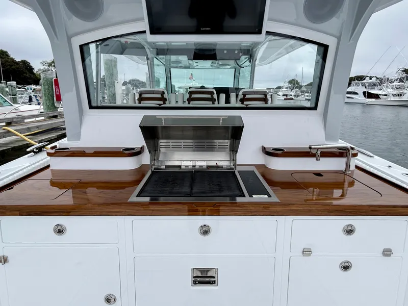 Slide: The Image of Outdoor kitchen on 2025 HCB 48 Campeon yacht with grill and sink. - 47