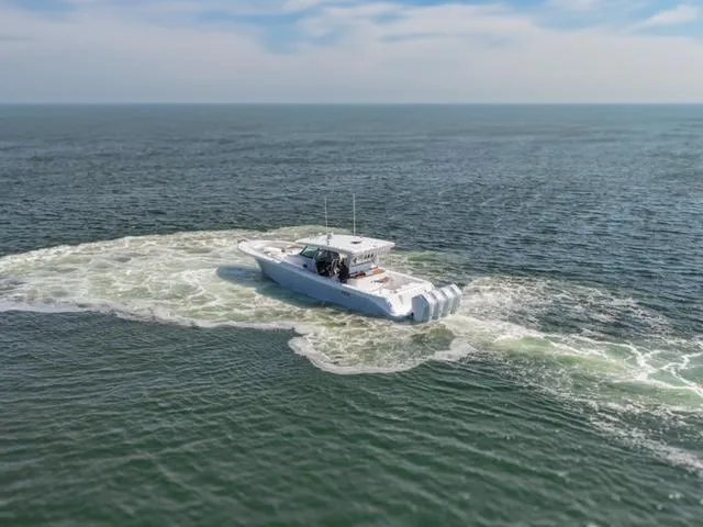 Slide: The Image of HCB 48 CAMPEON 2025 boat cruising on open water. - 9