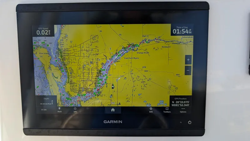 Slide: The Image of Garmin GPS display on 2023 Key West 250 Bay Reef boat showing navigation map. - 11
