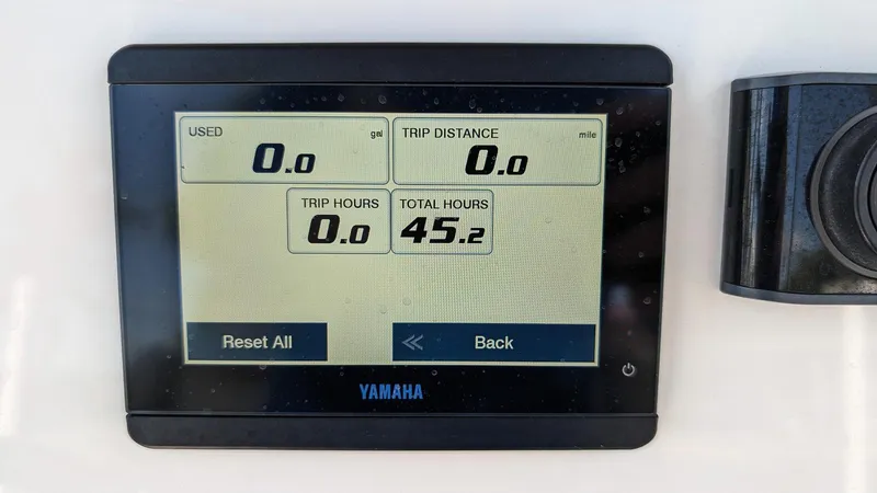 Slide: The Image of Yamaha display on 2023 Key West 250 Bay Reef showing trip and total hours. - 12
