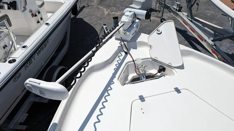 Slide: The Image of 2023 Key West 250 Bay Reef boat with trolling motor on deck. - 18