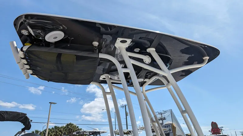 Slide: The Image of 2023 Key West 250 Bay Reef boat T-top structure under blue sky. - 20