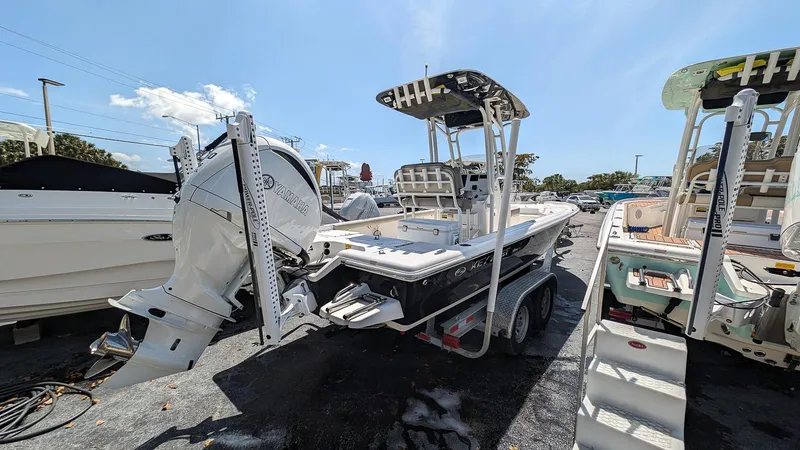 Slide: The Image of 2023 Key West 250 Bay Reef boat on trailer, rear view. - 4