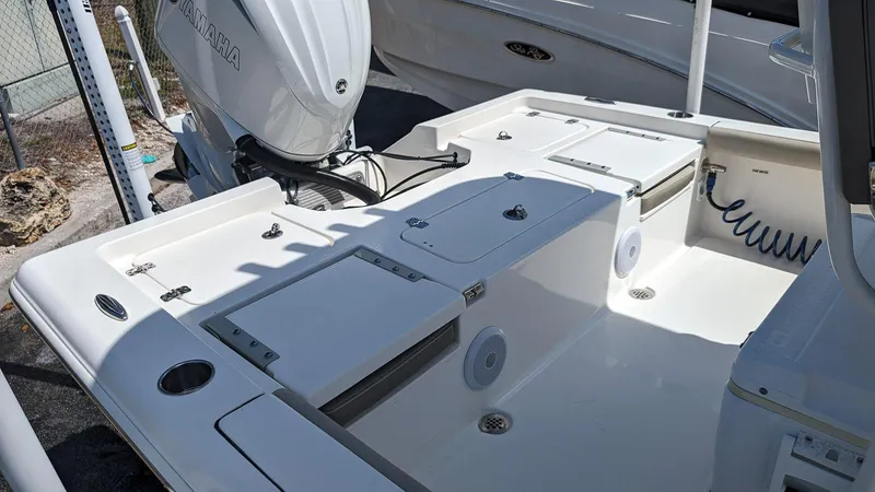 Slide: The Image of 2023 Key West 250 Bay Reef boat deck with Yamaha outboard motor. - 6