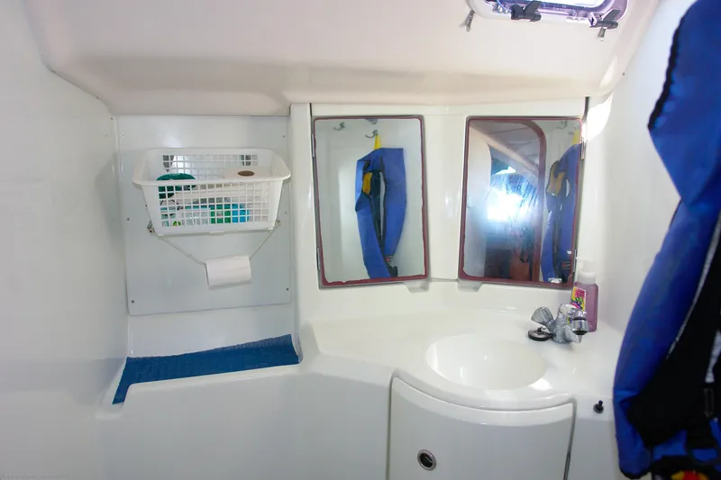 Slide: The Image of Bathroom interior of 1995 Beneteau Oceanis 351 sailboat with sink and mirrors. - 15
