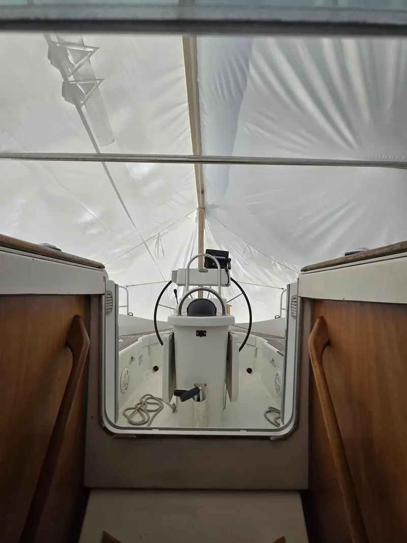Slide: The Image of Interior view of 1995 Beneteau Oceanis 351 sailboat cockpit under cover. - 16