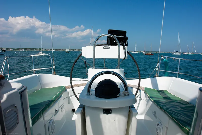 Slide: The Image of Cockpit view of 1995 Beneteau Oceanis 351 sailboat on calm water. - 23